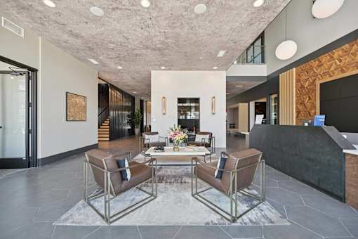 Lobby reception area with wood accent wall at Sequel Homes Apartments, Colorado