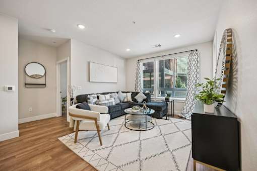 Bright living room with modern furniture at Sequel Homes Apartments, Englewood, CO