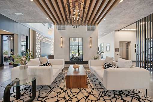 Lobby lounge with wood beam ceiling detail at Sequel Homes Apartments, Englewood, CO