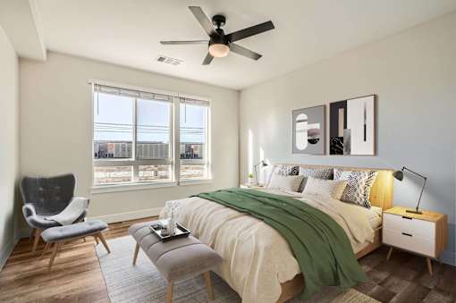 Bright bedroom with wood flooring and ceiling fan at Sequel Homes Apartments, Englewood, 80110