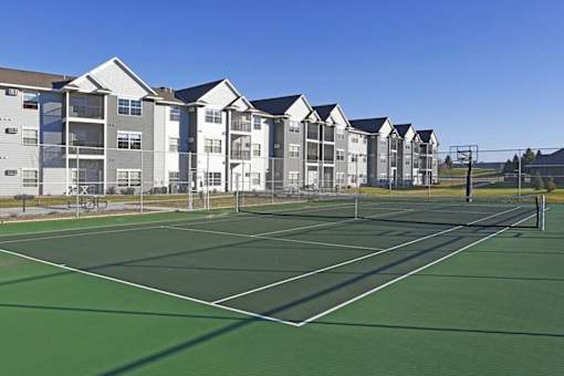Tennis with basketball hoop and fencing at Cypress Court Apartments, St Cloud, Minnesota