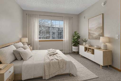 Bright bedroom with modern furnishings at Grand Gateway Apartments, Minnesota