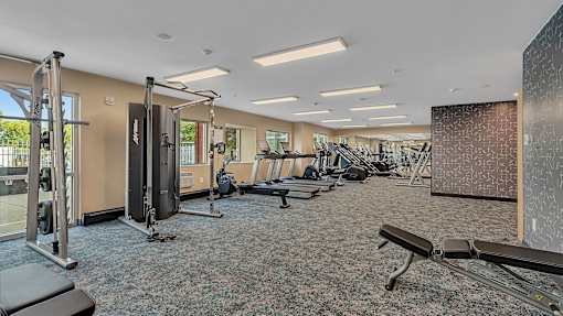 Spacious fitness center with cardio and strength equipment at Grand Gateway Apartments, Minnesota