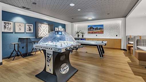 Game room with dome hockey and air hockey tables at Grand Gateway Apartments, St Cloud, MN 56301