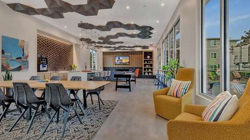 Modern clubhouse with dining area and lounge seating at Prosper West Apartments, Minnesota, 56387