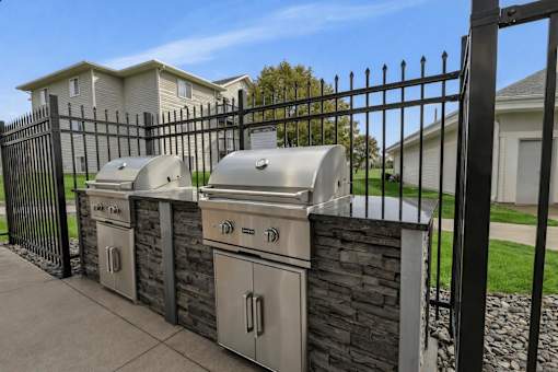 Community grilling station with stainless steel bbqs at Prosper West Apartments, Waite Park