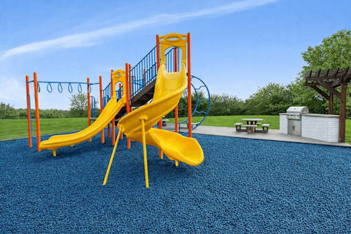 Playground with slides and monkey bars at Prosper West Apartments, Waite Park, 56387