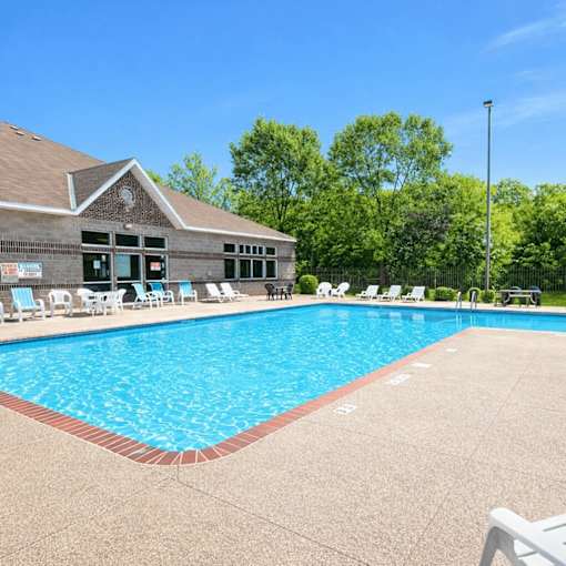 Outdoor swimming pool with poolhouse and sundeck at Regency Park Apartments, St Cloud, MN 56304