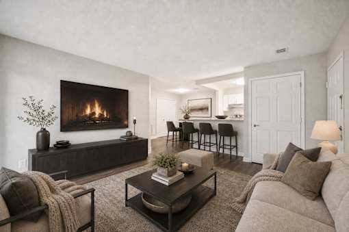 Living room with fireplace and open kitchen at Northview Park Apartments, Sterling Heights, MI 48310