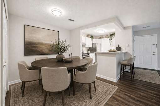 Dining area with round table and upholstered chairs at Northview Park Apartments, Sterling Heights, MI