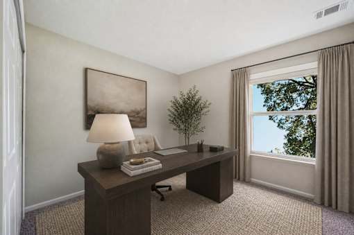Home office with dark wood desk and natural light at Northview Park Apartments, Sterling Heights, 48310