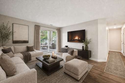 Living room with fireplace and neutral furnishings at Northview Park Apartments, Sterling Heights, Michigan