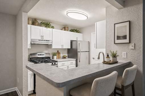 Modern kitchen with breakfast bar seating at Northview Park Apartments, Sterling Heights, MI 48310
