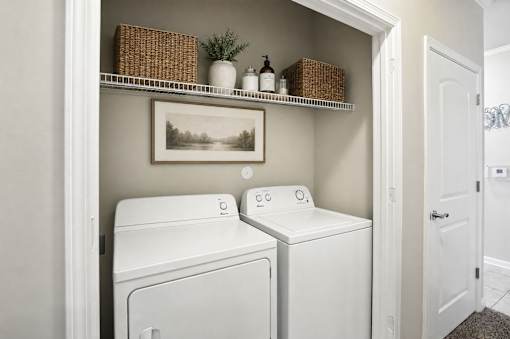 A laundry room with a washer and dryer.