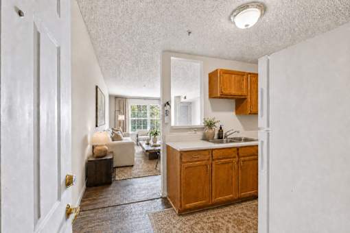 A kitchen with wooden cabinets and a sink.