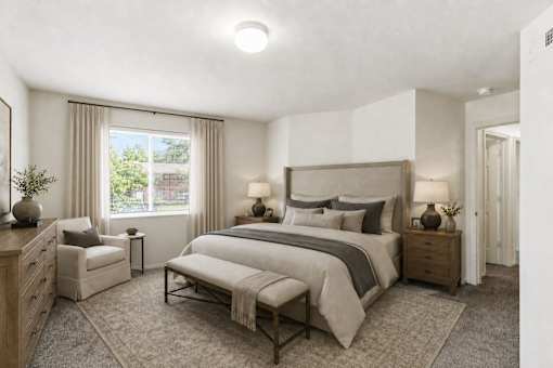 A bedroom with a large bed and a window with curtains at Slate Canyon Apartments, Utah