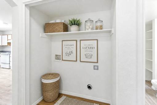 A laundry sign is on a wall above a trash can at Slate Canyon Apartments, Provo, UT, 84606