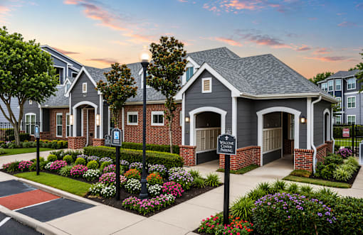 A row of houses with a sign in front of them.