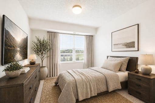 Cozy bedroom with natural light and neutral tones at Lakewood Apartments, Minnesota, 55014