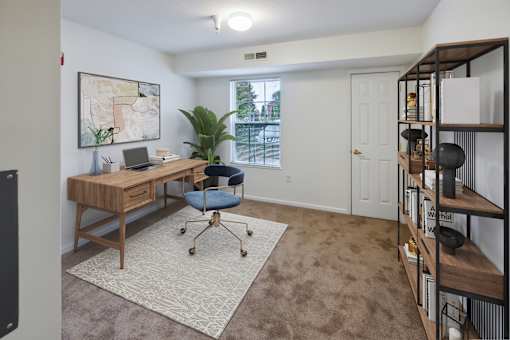 A room with a desk and a chair.