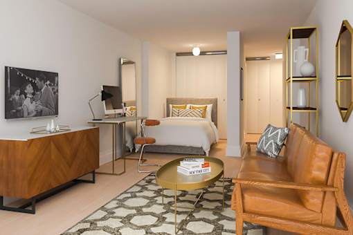 A modern bedroom with a bed, desk, and chair.
