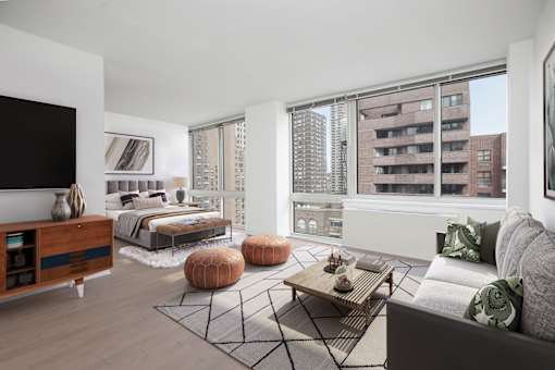A modern living room with a large window overlooking a cityscape.