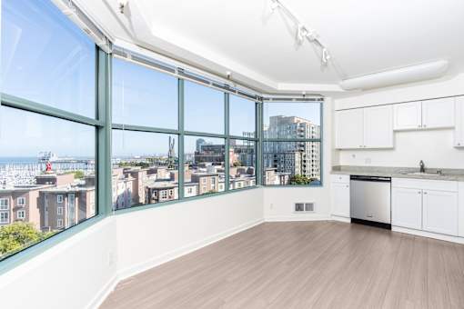 A kitchen with a view of the city.