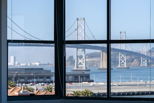A view of a bridge from a window.