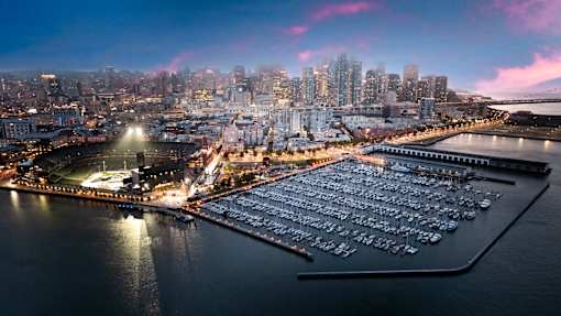 A marina filled with lots of boats at dusk.