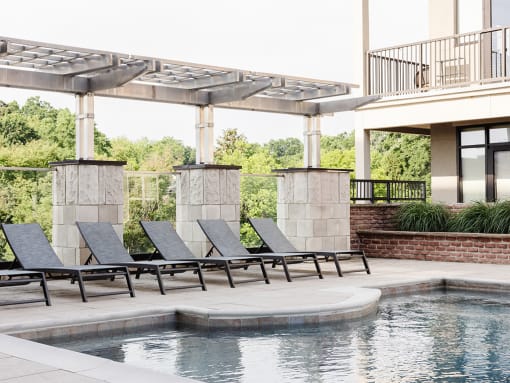Chaise lounge seating on the pool deck at St. Marys Square Apartments, Raleigh, North Carolina