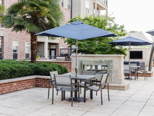 Outdoor dining tables at St. Marys Square Apartments, North Carolina, 27605