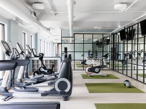 Fitness Center with cardio equipment at St. Marys Square Apartments, Raleigh, NC