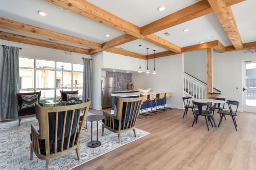 a dining room and living room with a table and chairs at Bristol at New Riverside, Bluffton, 29910