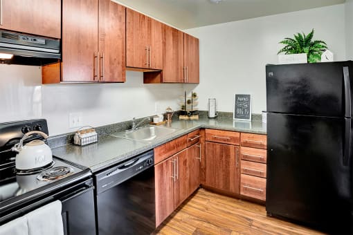 Kitchen with Black Appliances at Kenilworth at Charles Apartments, Towson, MD