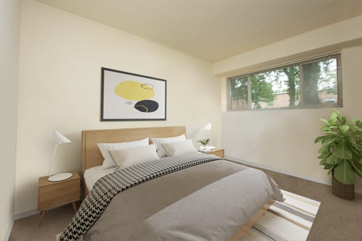 Bedroom with large windows at Cardiff Hall Apartments, Towson