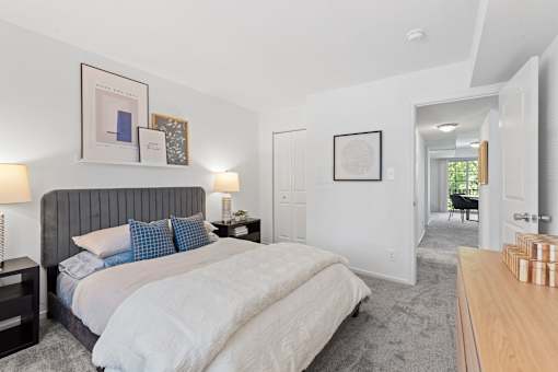 a bedroom with a bed and a closet at Courthouse Square Apartments, Towson, 21286