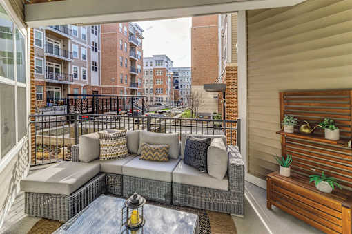 patio with a couch and a table at Dartmoor Place at Oxford Square Apartments, Maryland, 21076