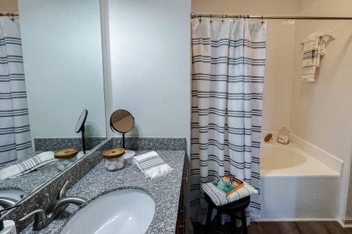 Vanity and tub/shower at Two Addison Place Apartments , Pooler, GA, 31322