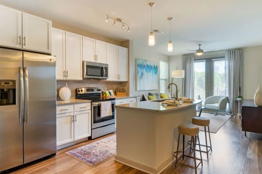 Kitchen with stainless steel appliances and island at 1010 Dilworth Apartments, Charlotte, NC 28204