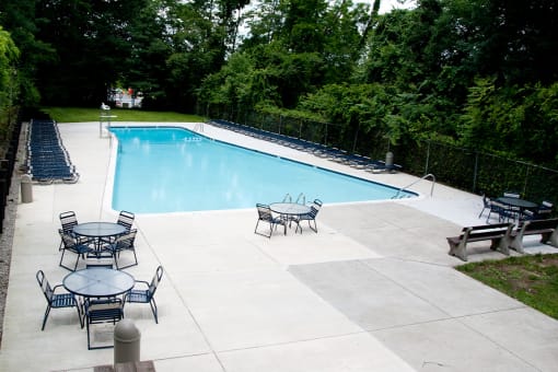 Swimming Pool with lounge seating, at Kenilworth at Charles Apartments, Maryland