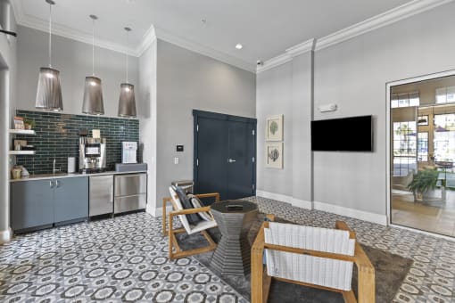 a lounge with a coffee bar and a table and chairs at Central Island Square, Daniel Island