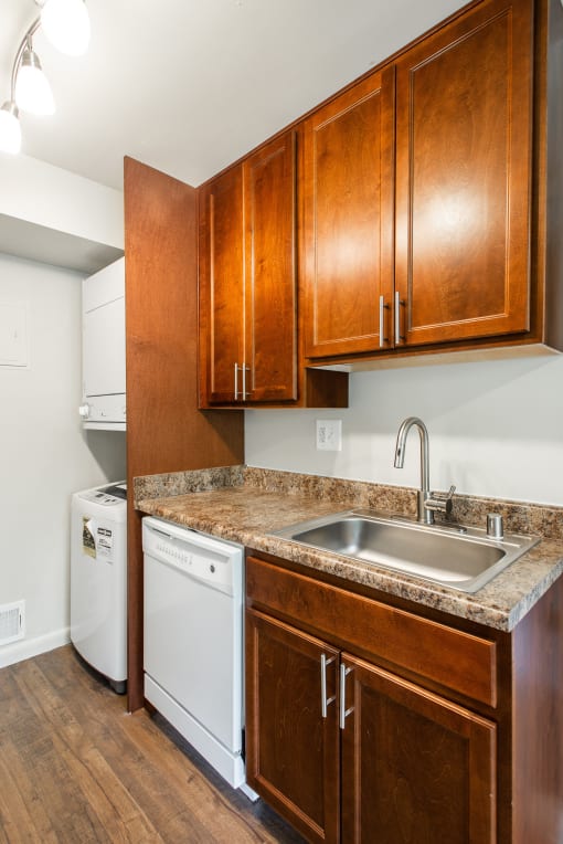 Kitchen area with washer and dryer and dishwasher  at Falls Village Apartments, Baltimore, MD, 21209