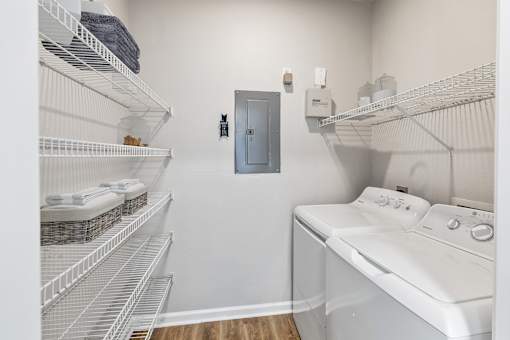 A laundry room with a washer and dryer and a door at Sweetgrass Landing, Mount Pleasant, South Carolina, 29466