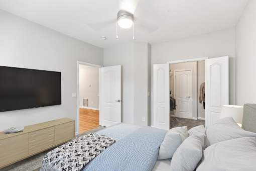 A bedroom with a large bed and a flat screen TV at Sweetgrass Landing, Mount Pleasant, SC, 29466