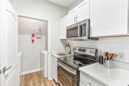 A kitchen with white cabinets and a black stove top at Sweetgrass Landing, Mount Pleasant, South Carolina, 29466
