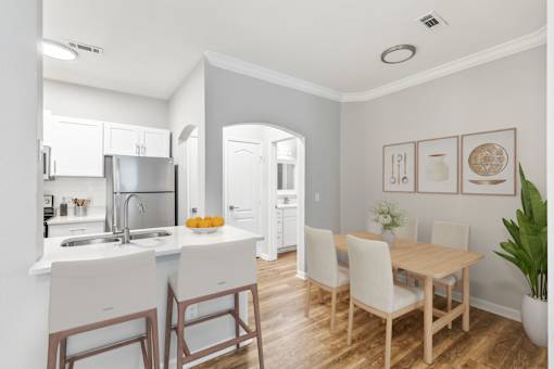 A kitchen with a table and chairs at Sweetgrass Landing, Mount Pleasant, South Carolina