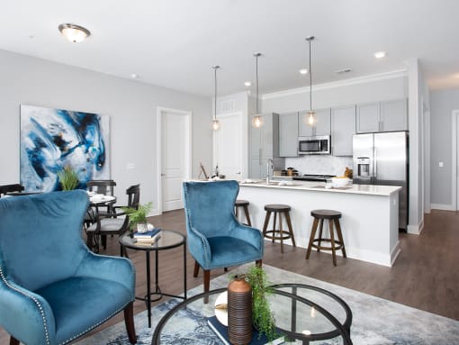 Living room and kitchen with island at St Mary's Square North Apartments, Raleigh, NC, 27605