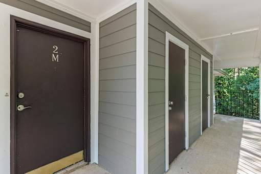 A row of doors with the first one labeled 2M.