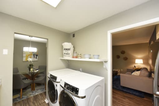 Two BR Apartments in Vestavia Hills, AL - MarQ Vestavia - Full-Size Front Load Washer and Dryer with Shelving and Hardwood-Style Flooring
