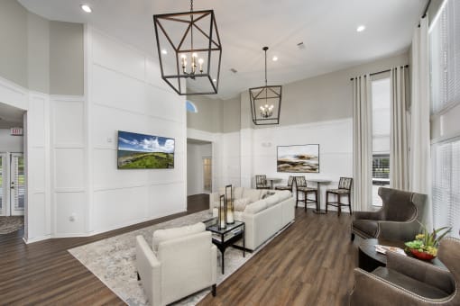 a living room with couches and chairs